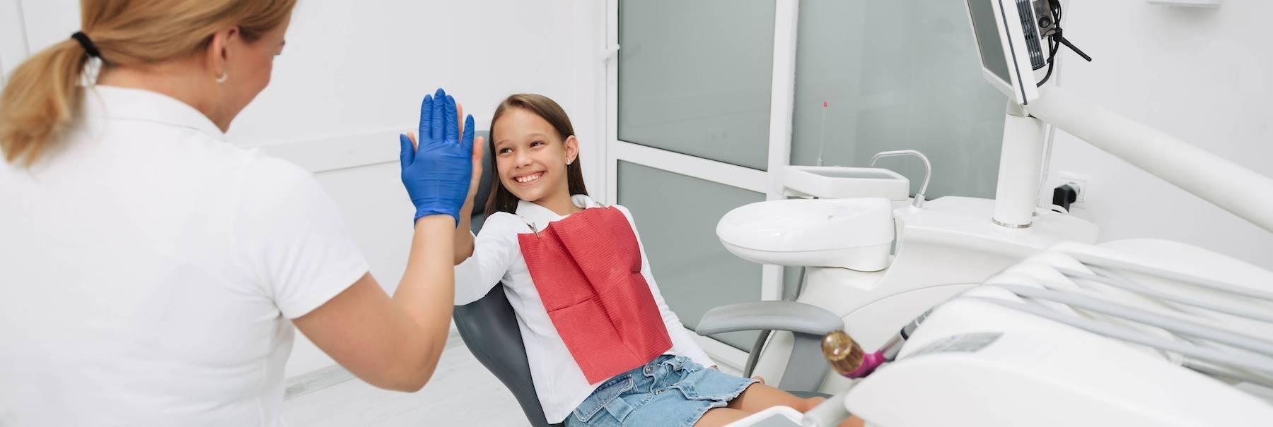 girl having fun during dental exam in glenmont ny